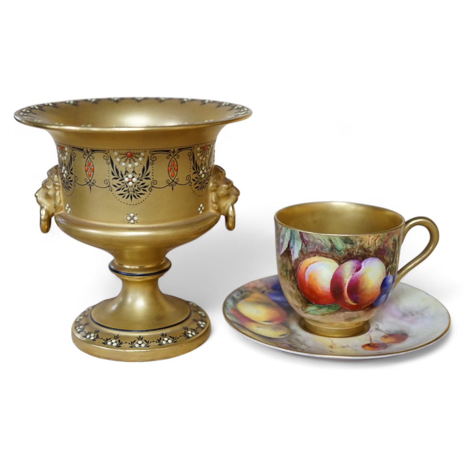 A Royal Worcester miniature fruit painted cup and saucer, Hale and Everett, and an unusual gilded campana vase, 10cm high. Condition - saucer cracked, otherwise good